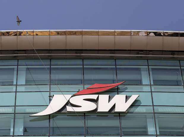 The logo of JSW is seen on the company's ...