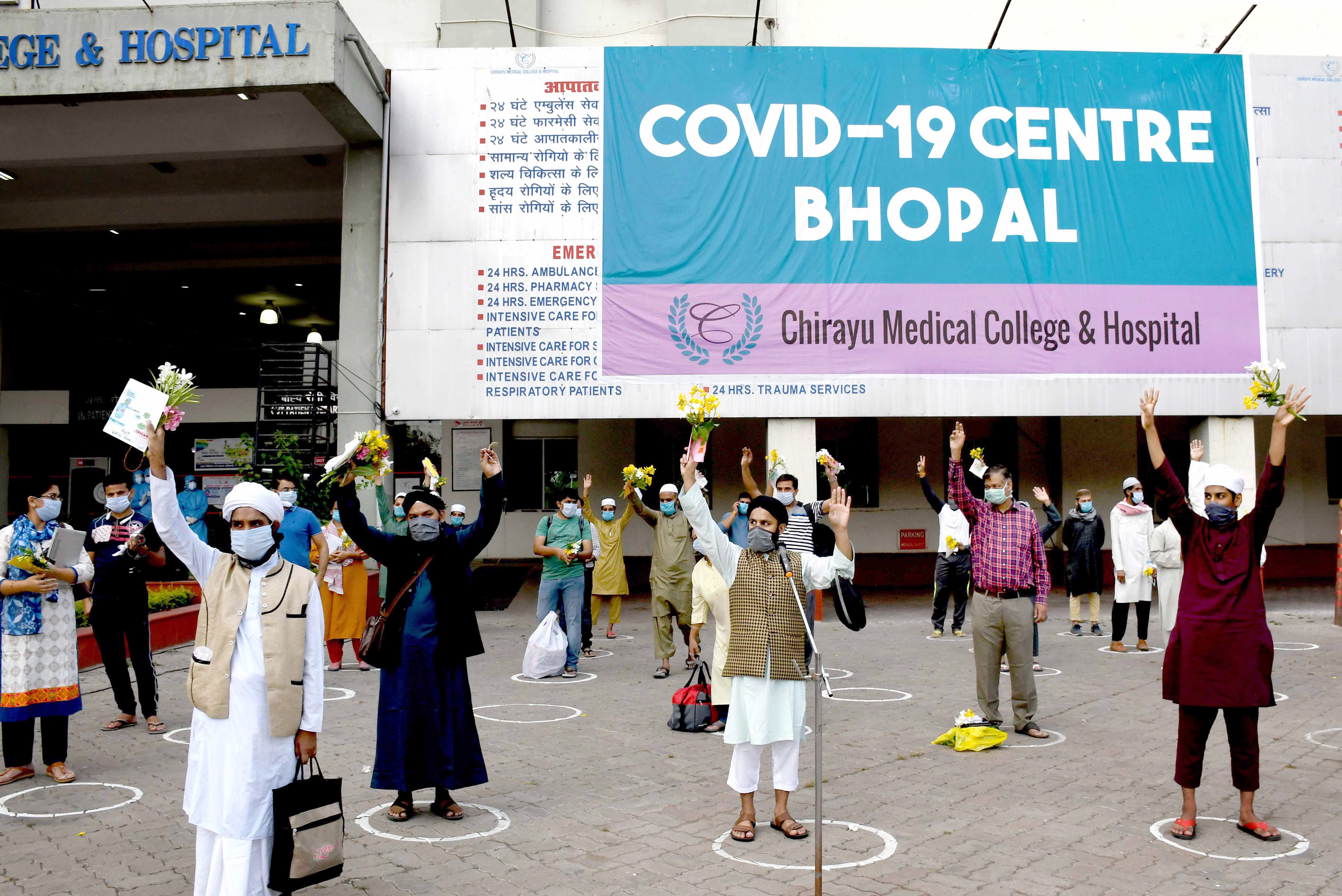 Coronavirus positive patients being discharged from Chirayu Medical College and Hospital after their treatment of COVID-19 disease,  get cured during nationwide lockdown to curb the spread of coronavirus in Bhopal on Sunday. 28 patients were dischar