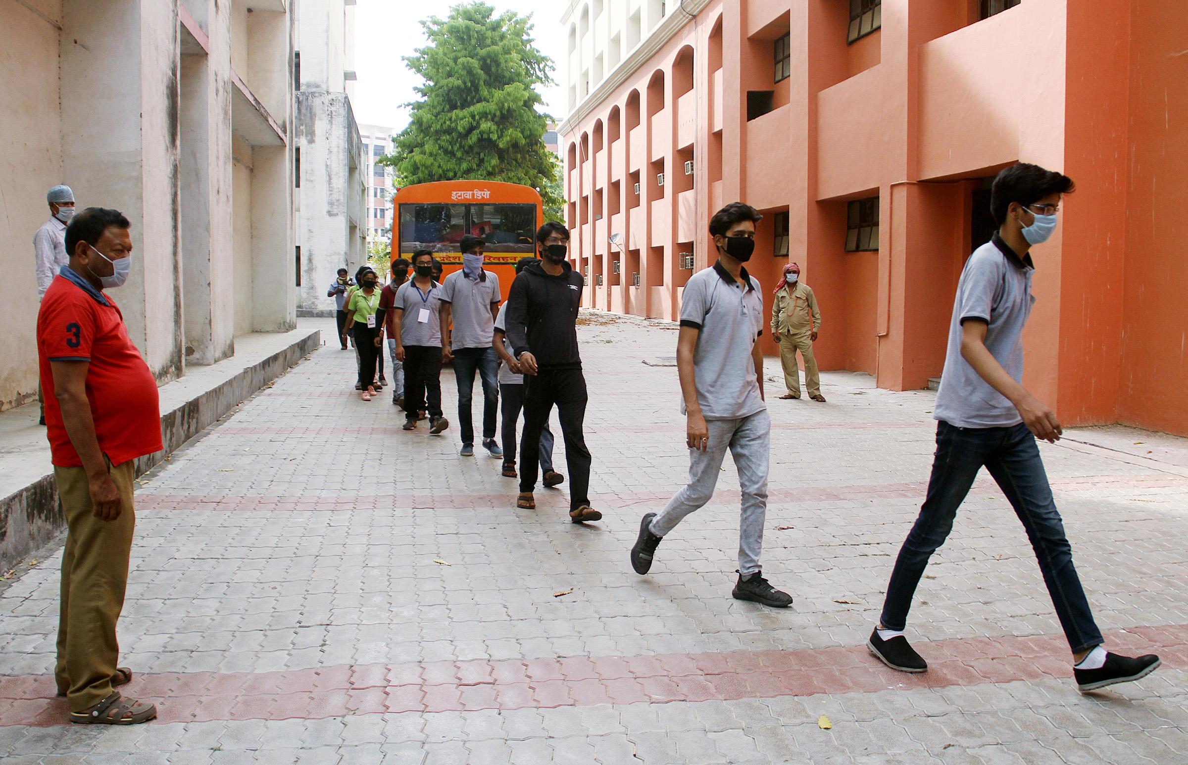 Students who were stranded in Kota brought back by UP government arrives at quarantine centre of BBD University for a medical checkup during coronavirus lockdown, in Lucknow on Sunday.